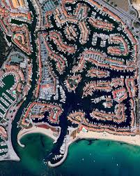 Port Grimaud Is A Seaside Town Located On The French Riviera By The Gulf Of Saint Tropez The Development Consists Of Fren French Riviera Seaside Towns Riviera