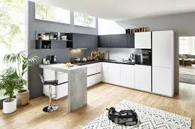 The dark granite countertop complements the woodwork and the dark glass in the stainless steel appliances. Kitchen Design Ideas For Your Nolte Kitchen Online Nolte Kuechen Com
