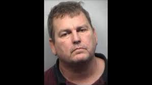 Former wrestling coach arrested