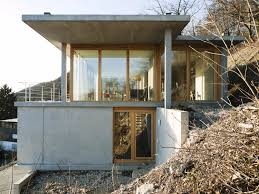 In plan, the house consists of three volumes that are split underneath the sloped roof. House On A Slope Gian Salis Architect Archdaily