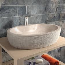 Made from beige travertine, the unique sloping lines and boat shape of the sink give it an aesthetic that works well in modern spaces as well as bathrooms where nature is the focus. Luxury Beige Bathroom Sinks Perigold