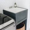 Stainless steel laundry/ utility sink and cabinet. 1