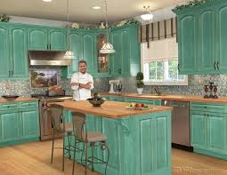 In this post, i will be talking about how to use the wood from pallets to build yourself some great rustic kitchen cabinets that will totally change the feel of your space, all for the price of a little elbow grease. Kitchen Distressed Kitchen Cabinet Colors Turquoise Kitchen Accents Rustic Teal Kitchen Cabin Kitchen Design Turquoise Kitchen Cabinets Country Kitchen Decor