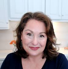 What is the tree with peeling bark and heavy trimming?