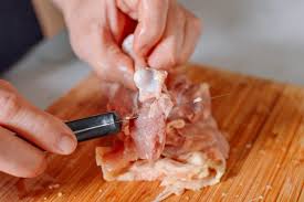 Make the first cut at the natural crease between the leg and the body. How To Debone Chicken Thighs The Woks Of Life
