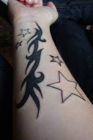 Black ink tree tattoo on left wrist for men. 25 Wrist Star Tattoos For Men