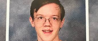 Gunman had photos of Trump, Biden and other US officials