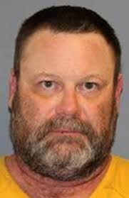 Man accused of aiming guns at his neighbors