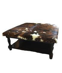 While you are wrapping and pulling tight, staple the cowhide to the bottom of the ottoman. Cowhide Ottoman Coffee Table With Lower Shelf Custom Sizes Available