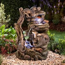 A statue of mary the mother of jesus is placed in a bathtub half buried under the ground. Serenity Xl Otter Family Water Feature Telegraph Shop