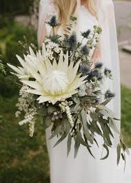Immaculate roses or lilies are purple thistle is the star of this wildflower wedding bouquet. 30 Amazing Protea Wedding Bouquets Martha Stewart