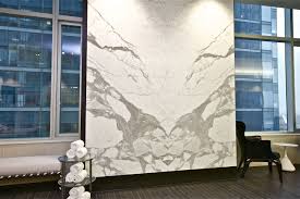 Book Matched Statuario Marble Wall Surrounding The Swimming Pool At Trump International Hotel Tower Toron Contemporary Fireplace Marble Wall Statuario Marble