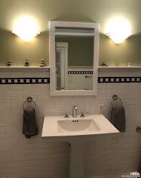 The black subway tile makes the white cabinetry pop and it picks up the farmhouse pulls. Classic White Subway Tile Black White Checker Border Nkba