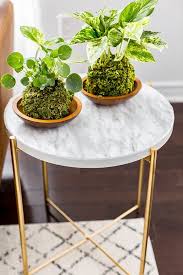 Easy Ikea Decor Hack From Plain Side Table To A Marble Masterpiece Hunker Ikea Decor Side Table Decor Ikea Furniture Hacks