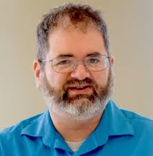 Dr. Gerry Canavan, chair and professor of English in the Klingler College  of Arts and Sciences, spoke with Portside