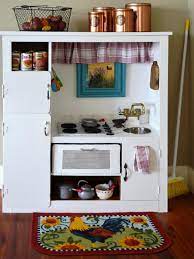 Save money by turning a popular (but inexpensive) 1980s piece of furniture into a personal kitchen for your budding little chefs. How To Turn An Old Entertainment Center Into A Play Kitchen How Tos Diy