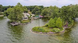 The population was 7,451 at the 2000 census. Island Home On Oconomowoc Lake Sold For 2 25 Million