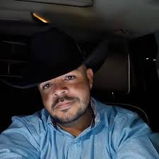 Where is the charger for a Genie scissor lift?