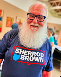 I met Santa today! He was in my hometown of Ashtabula. In the off-season he  calls himself Greg Gnau, but come December he'll be donning that red suit.  (For real.) He pressed