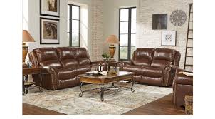 This well designed sofa and loveseat set will upgrade your living decor featuring a rolled arm, genuine leather upholstery and accented with nailheads on the arms and front panel. 2 444 00 Abruzzo Brown 5 Pc Reclining Leather Living Room Traditional