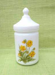 It's that time of year where dollar tree is getting us ready for summer fun: Vintage Milk Glass Apothecary Jar With Yellow Flowers Made In France On Sale Glass Apothecary Jars Milk Glass Vintage Milk Glass