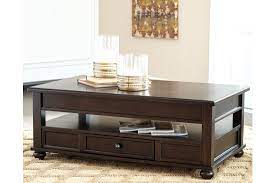 Ashley furniture ferlin 3 piece round coffee table set in dark brown. Ashley Barilanni Coffee Table With Lift Top Austin S Furniture Depot