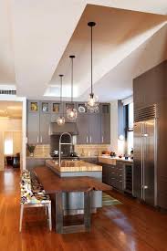 The tray ceiling brings contrast to the kitchen that is mostly in white. How Much Does An Island Cost With Contemporary Kitchen And Breakfast Bar Colorful Kitchen Chairs Contemporary Pendant Light Eat In Kitchen Islands Kitchen Island Pendant Lighting Recessed Ceiling Tray Ceiling Wood Floors