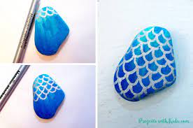 This mermaid themed wall art with diy fish scales is a gorgeous statement piece that you can make with very little effort! How To Draw Mermaid Scales On Painted Rocks Projects With Kids