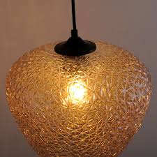 A brass chandelier that was too brassy bright and in my case cheap looking. Glass Pendant Lamp In Champagne Scarl Ett