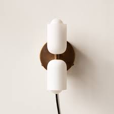 Wall sconces installed as task lighting on either side of a mirror or vanity must be spaced 36 to 40 inches apart to avoid shadows. Glass Up Down Plug In Wall Sconce By In Common With Sp 101121