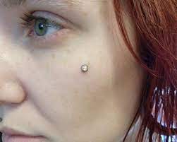Extreme To Mainstream Cheek Piercing Pictures Dermal Piercing Cheek Piercings Piercing