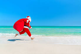 Santa Claus Running Along Beach With Sack Full Of Gifts Stock Photo - Download Image Now - iStock