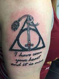New Harry Potter Tattoo Deathly Hallows With The Sword Of Gryffindor And Slytherin S Locket Wit Harry Potter Tattoos Harry Potter Tattoo Harry Potter Symbols