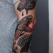 Snake Head Between Some Rad Tattoos By My Friend Jonastattooing Tonybluearms Traditional Snake Tattoo Sleeve Tattoos Tattoos