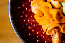 Traditionally, the term caviar refers only to roe from wild sturgeon in the caspian sea and black sea (beluga, ossetra and sevruga caviars). High Angle Close Up Of Chef Preparing Uni Sea Urchin With Salmon Roe And Rice Stockphoto