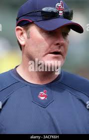 Cleveland Indians manager Eric Wedge, center, pulls starting pitcher Fausto  Carmona (55) for a reliever after a two-run homer by Texas Rangers' Brad  Wilkerson in the sixth inning of a baseball game