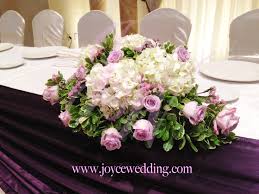 The tall flower stalks of verbena bearing a cluster of stunning purple blooms growing in a mass create a scenic vista. Purple And White Fresh Flower Arrangement For Wedding Joyce Wedding Services