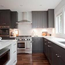 Dark cabinets don't have to be black—if the midnight mood isn't for you, consider a lighter shade of brown. Dark Grey Quartz Countertops Design Ideas