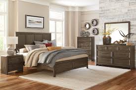 This primary bedroom boasts stunning gray walls along with a large bed. Seldovia Bedroom Set 5pc 1619 In Brown Gray By Homelegance