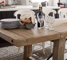 The contemporary dining table will be the perfect addition to your lodge, home, cottage, or cabin for years to come! Benchwright Extending Dining Table Pottery Barn