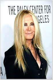 Here, she is wearing a long layered bob with very wispy bangs and a huge smile on her face. 65 Gracious Hairstyles For Women Over 60