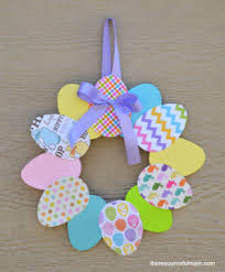 Stage 12 make a small hole in either side of the mask and tie on the elastic so that it is a. Easy Paper Easter Wreath The Resourceful Mama