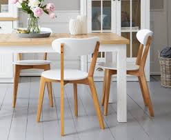 Molded seat wrapped in grey polyester fabric, legs have light oak foil wraps • measurements: Dining Chairs Jysk