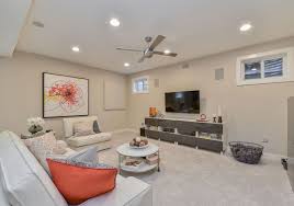 This modern basement apartment showcases the best use of small spaces with an office, dining area, and ample living room space. Pin By John Huikku On Boys Room Decor Modern Basement Modern Basement Ideas Basement Living Rooms