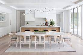 This white washed live edge dining table is perfect for any coastal or beach inspired setting. Tour This Light Filled Coastal Modern Inspired Home In Minnesota
