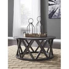 Signature Design By Ashley Sharzane Round Cocktail Table In Grayish Brown Nebraska Furniture Mart Round Cocktail Tables Coffee Table Furniture