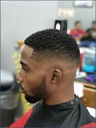 The outgrown top is styled in a side mohawk that looks simply stunning. 12 Fade Haircut Black Undercut Hairstyle