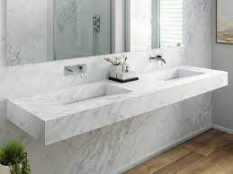The marble sinks are available in a round, conical, square and rectangle designs with every piece possessing a unique character. Double Carrara Marble Washbasin With Integrated Countertop Carrara C1 Double Washbasin By Riluxa