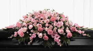 The casket will give originality to your interior. Shades Of Pink White Cascading Casket Spray Dedham Flower Shop