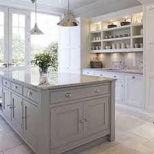 Designed By The Talented Tom Howley French Pattern Travertine Floors Custom Shaker Kitchen Cabinet Design Grey Kitchen Island Kitchen Cabinets Grey And White